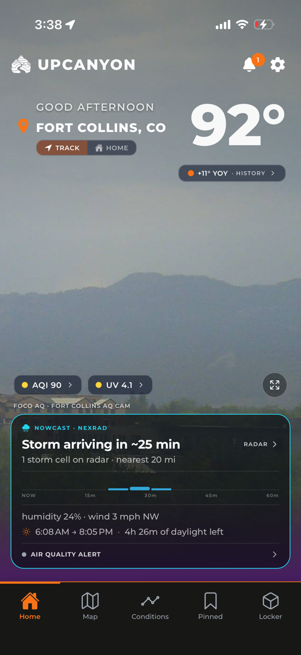 UpCanyon home screen: a live Fort Collins camera behind the current temperature, with a nowcast card reading storm arriving in about 25 minutes
